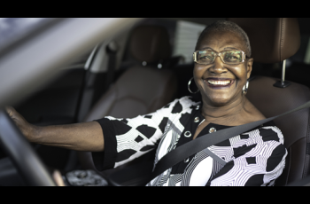 Older African American women Driving her car