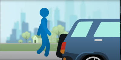 screenshot of video. cartoon pedestrian on sidewalk.