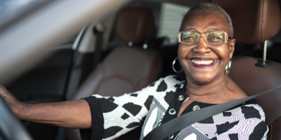 An older adult driving a car 
