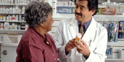 Doctor explaining a prescription to a patient. 